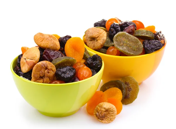 Dried fruits in bright bowls isolated on white — Stock Photo, Image