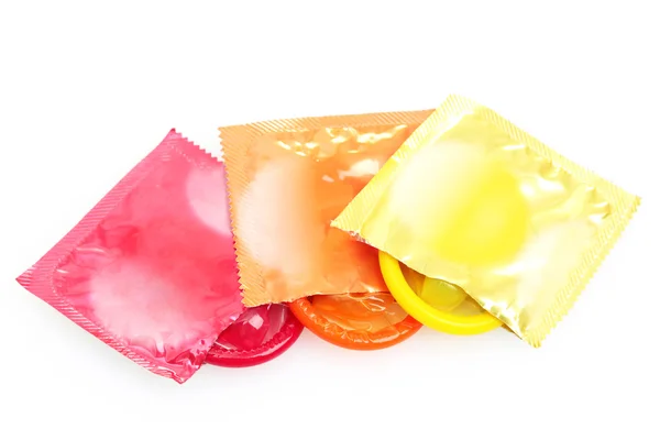 Preservativos coloridos isolados em branco — Fotografia de Stock