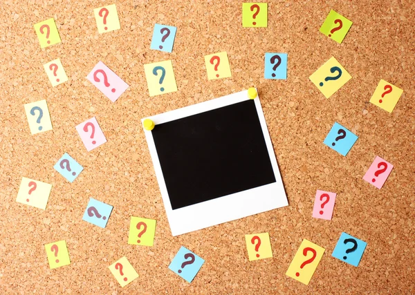Photo with question marks cork board — Stock Photo, Image