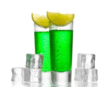 Glasses of absinthe, ice and lime isolated on white clipart