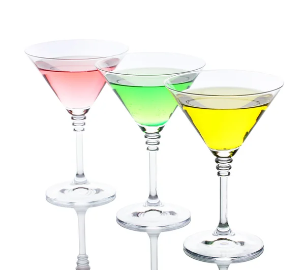 Alcoholic cocktails on table isolated on white — Stock Photo, Image