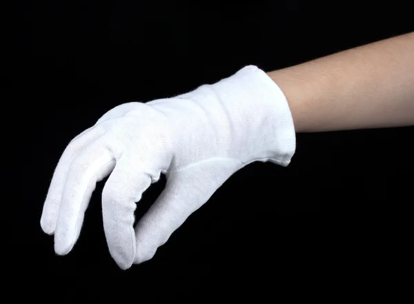 Doek handschoen op hand op zwarte achtergrond — Stockfoto