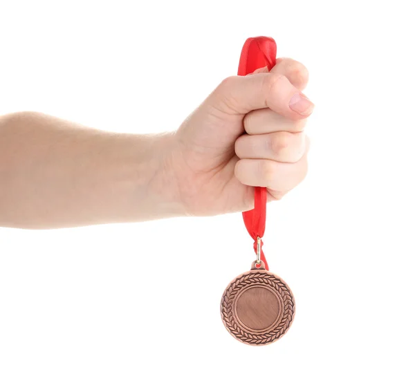 Bronze medal in hand isolated on white — Stock Photo, Image