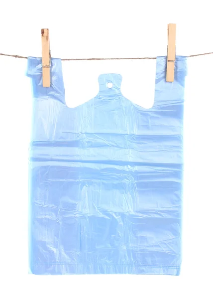 Cellophane bag hanging on rope isolated on white — Stock Photo, Image