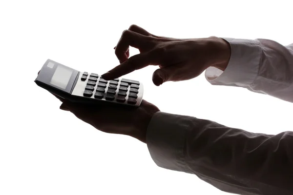 stock image Silhouette of womans hands with calculator isolated on white