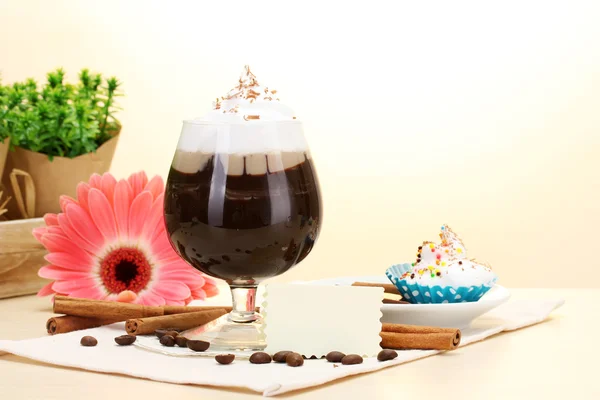 stock image Glass of coffee cocktail and gerbera flower on wooden table