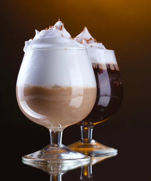 Glasses of coffee cocktail on brown background — Stock Photo, Image