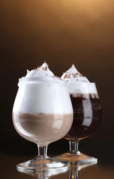 Glasses of coffee cocktail on brown background — Stock Photo, Image