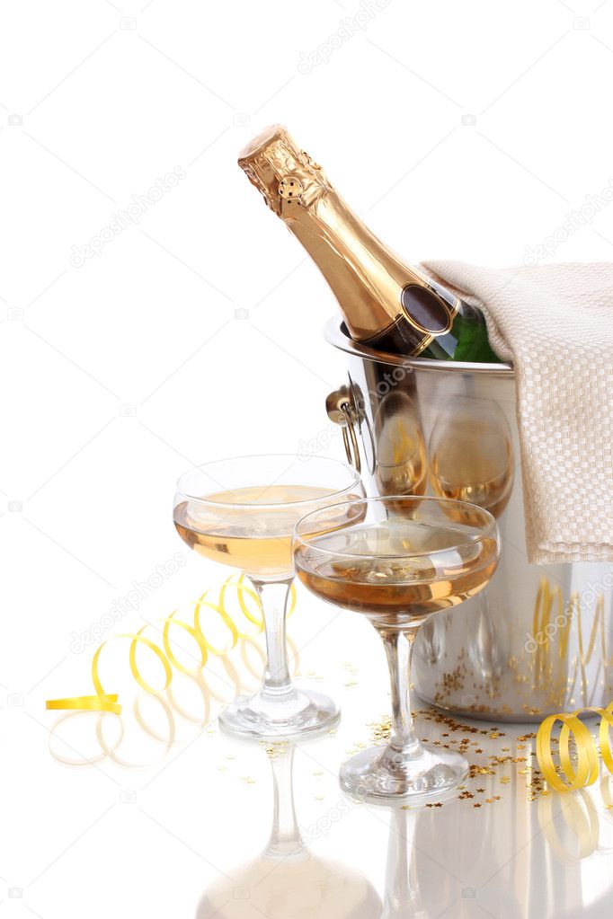 Champagne bottle in bucket with ice and glasses of champagne, isolated on white