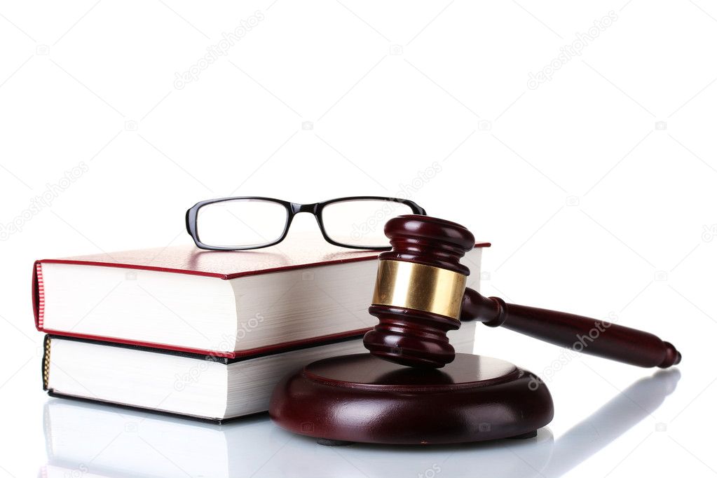 Wooden gavel, glasses and books isolated on white