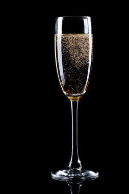 Glass of champagne on black background clipart