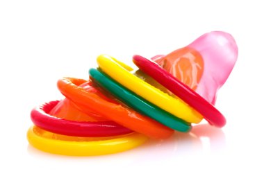 Colorful condoms isolated on white clipart