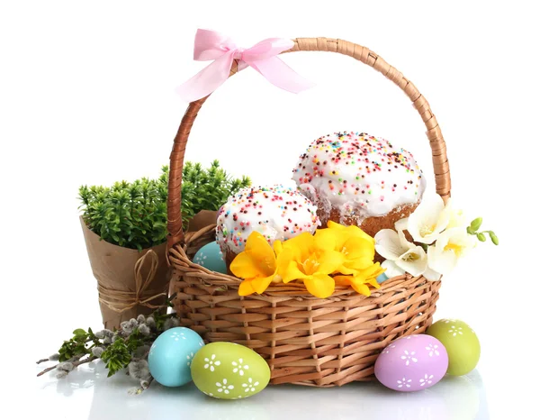 stock image Beautiful Easter cakes, colorful eggs in basket and flowers isolated on white