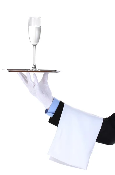 Офіціант зі склянкою води на срібному підносі ізольовані на білому — стокове фото