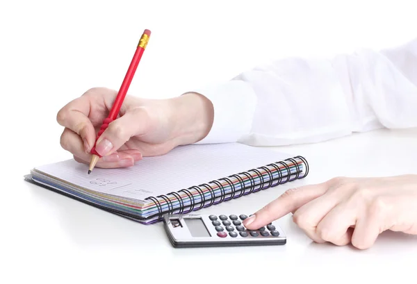 Mulheres mãos com lápis, caderno e calculadora isolado em branco — Fotografia de Stock