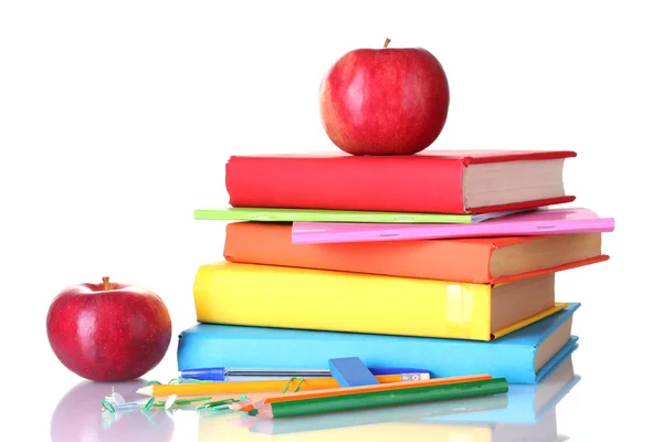 Sammansättningen av böcker, pappersvaror och en äpplen isolerad på vit — Stockfoto