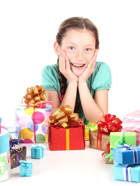 Little girl with gifts isolated on white — Stock Photo, Image