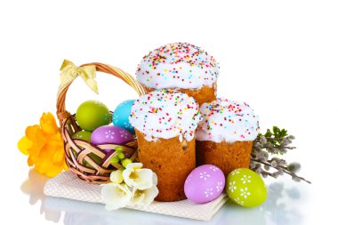 Beautiful Easter cakes, colorful eggs in basket and flowers isolated on white clipart