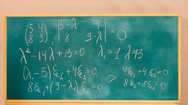 Formulas written on green chalkboard — Zdjęcie stockowe