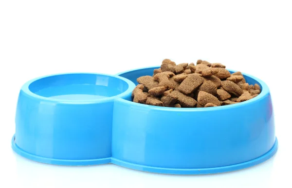 Dry dog food and water in blue bowl isolated on white — Stockfoto