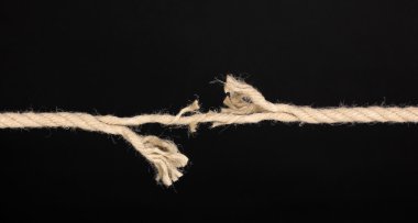 Breaking rope isolated on black clipart