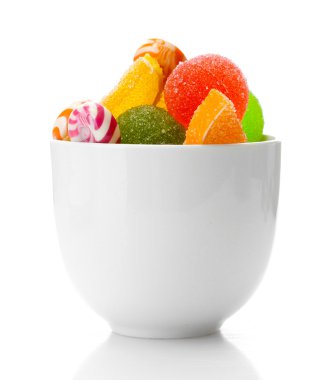 Colorful jelly candies in bowl isolated on white clipart