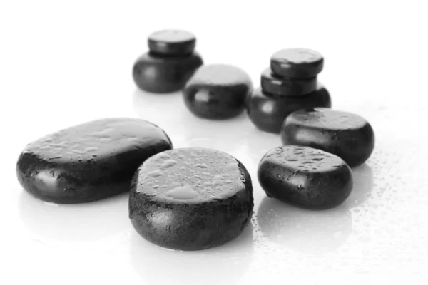 Spa stenen met druppels geïsoleerd op wit — Stockfoto