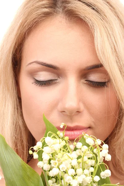 Beautiful young woman with lilies of the valley on white background close-up — Stock Photo, Image