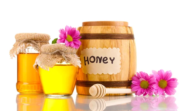 Sweet honey in barrel and jars with drizzler isolated on white — Stock Photo, Image