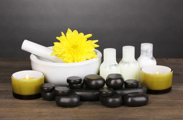 Spa setting on wooden table on grey background — Stock Photo, Image