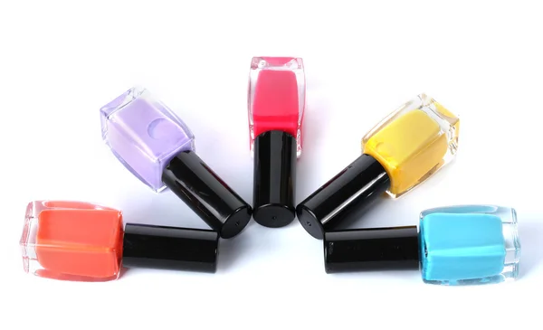 Grupo de esmaltes de uñas brillantes aislados en blanco —  Fotos de Stock