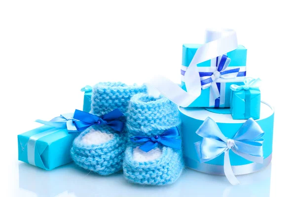 Beautiful gifts and babys bootees isolated on white — Stock Photo, Image