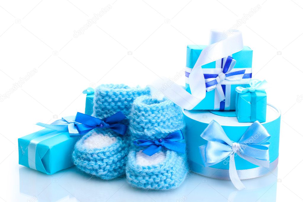 Beautiful gifts and babys bootees isolated on white