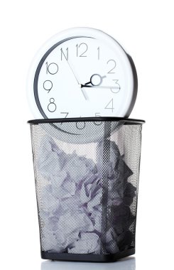 Wall Clock and paper in metal trash bin isolated on white clipart