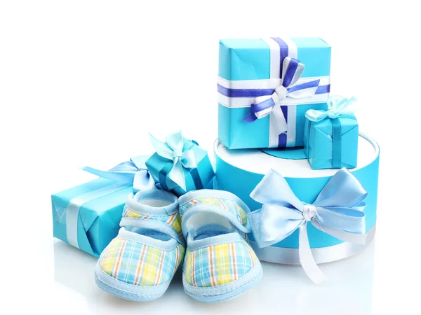 Beautiful gifts and babys bootees isolated on white — Stock Photo, Image