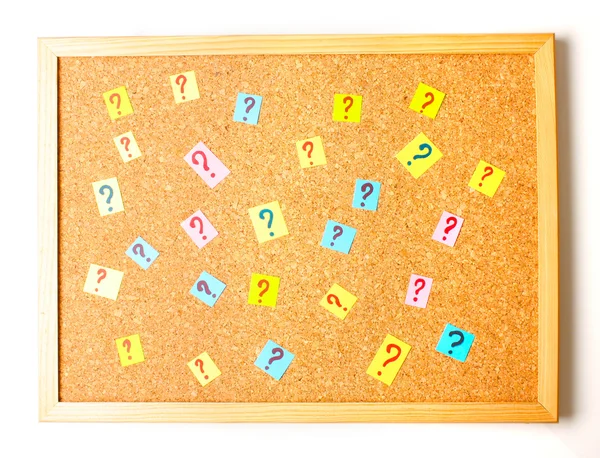Many question marks on cork board — Stock Photo, Image