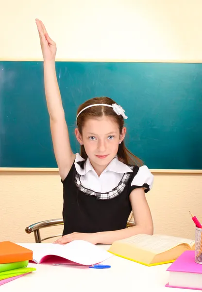 Beautiful little schoolgirl in classroom — Stock Photo, Image