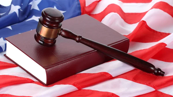 Judge gavel and book on american flag background — Stock Photo, Image