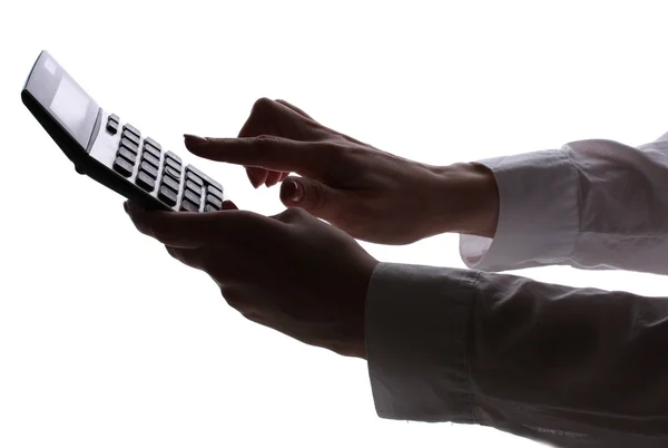 stock image Silhouette of womans hands with calculator isolated on white