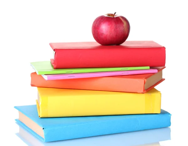 Composição de livros escolares e uma maçã isolada em branco — Fotografia de Stock