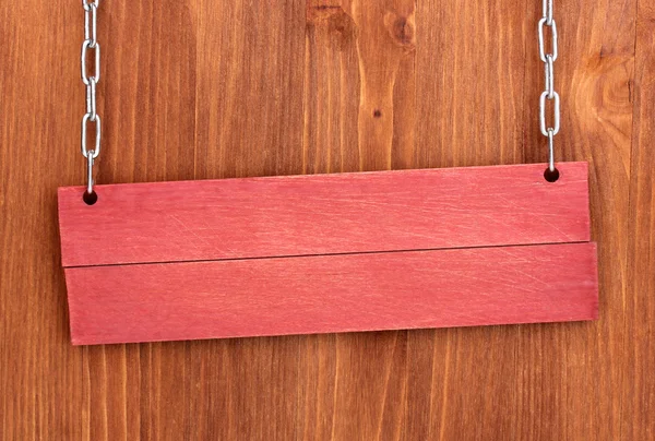 Cartello in legno a colori su sfondo in legno — Foto Stock