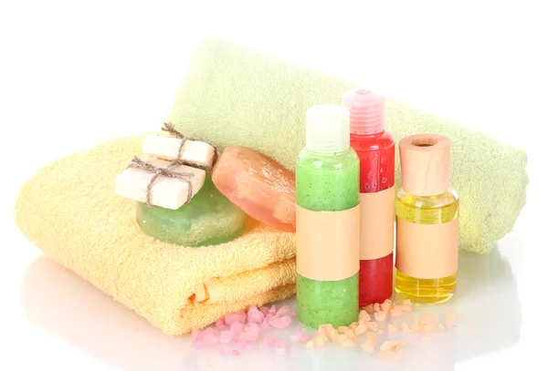 Bottles, soaps, sea salt and towels isolated on white — Stock Photo, Image