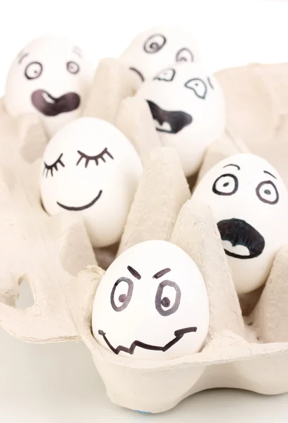 Jaja białe z śmieszne twarze — Zdjęcie stockowe