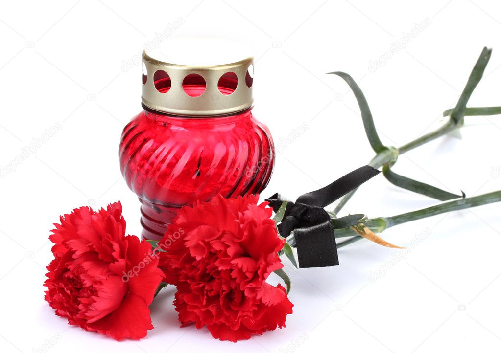 Memory lantern with candle, carnations and black ribbon isolated on white