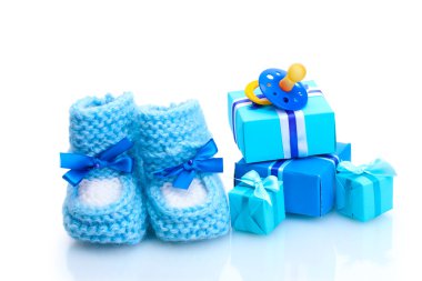 Beautiful gifts, babys bootees and dummy isolated on white clipart