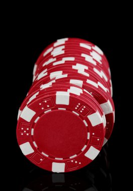 Casino chips isolated on black clipart