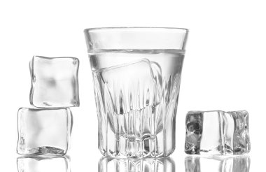 Glass of vodka with ice isolaled on white clipart