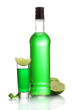 Bottle and glass of absinthe with lime isolated on white clipart