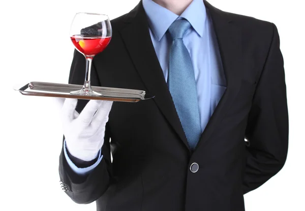 Camarero formal con una copa de vino en bandeja de plata aislada en blanco —  Fotos de Stock