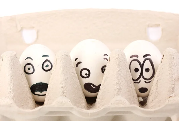 Ovos brancos com rostos engraçados — Fotografia de Stock